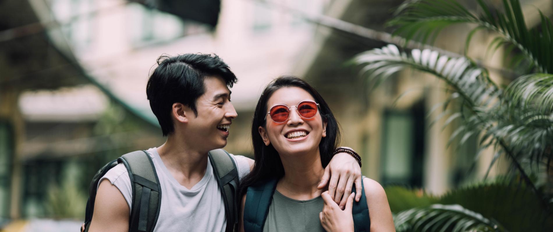 Young Couple Arms Around