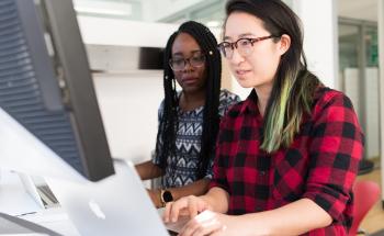 Two women at a computer